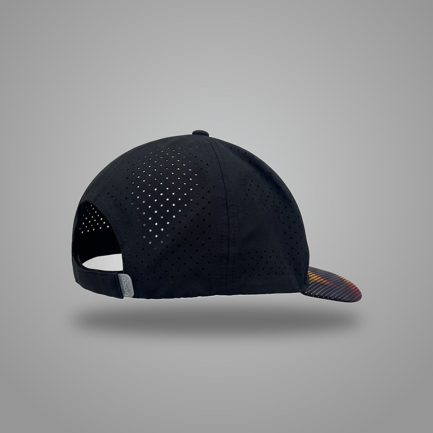 Black OMIUS Off Duty Cap, front view with embroidered logo and colorful dotted brim.